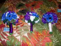 Silk flower bouquets for the bride, maid of honor and flower girl, made by Creative Edge Events (www.chebellaevents.com). They were purple and blue anemones with white magnolias.