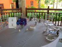 The bride and groom had resort tables with their own centerpieces, table cards and favors.