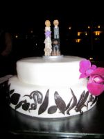 Our cake topper with the standard cake the resort provided.
