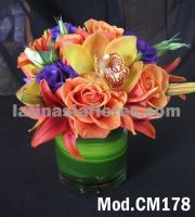orange roses and lilies with purple lisianthus and yellow cymbidium orchid wedding centerpiece
