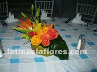 colorful centerpiece in a coconut as a vase