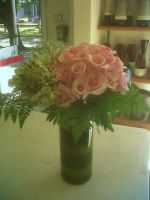 pink roses and white alstroemeria with baby's breath wedding centerpiece