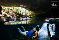 *
Cenote couple kiss in romantic underwater fantasy-world