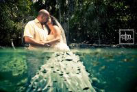 *
Fish surround embracing cenote couple