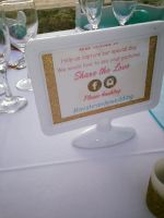 My DIY hashtag photo signs had on each table