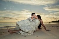 Sun rises with a golden light to honor the newlyweds in their trash the dress sesion