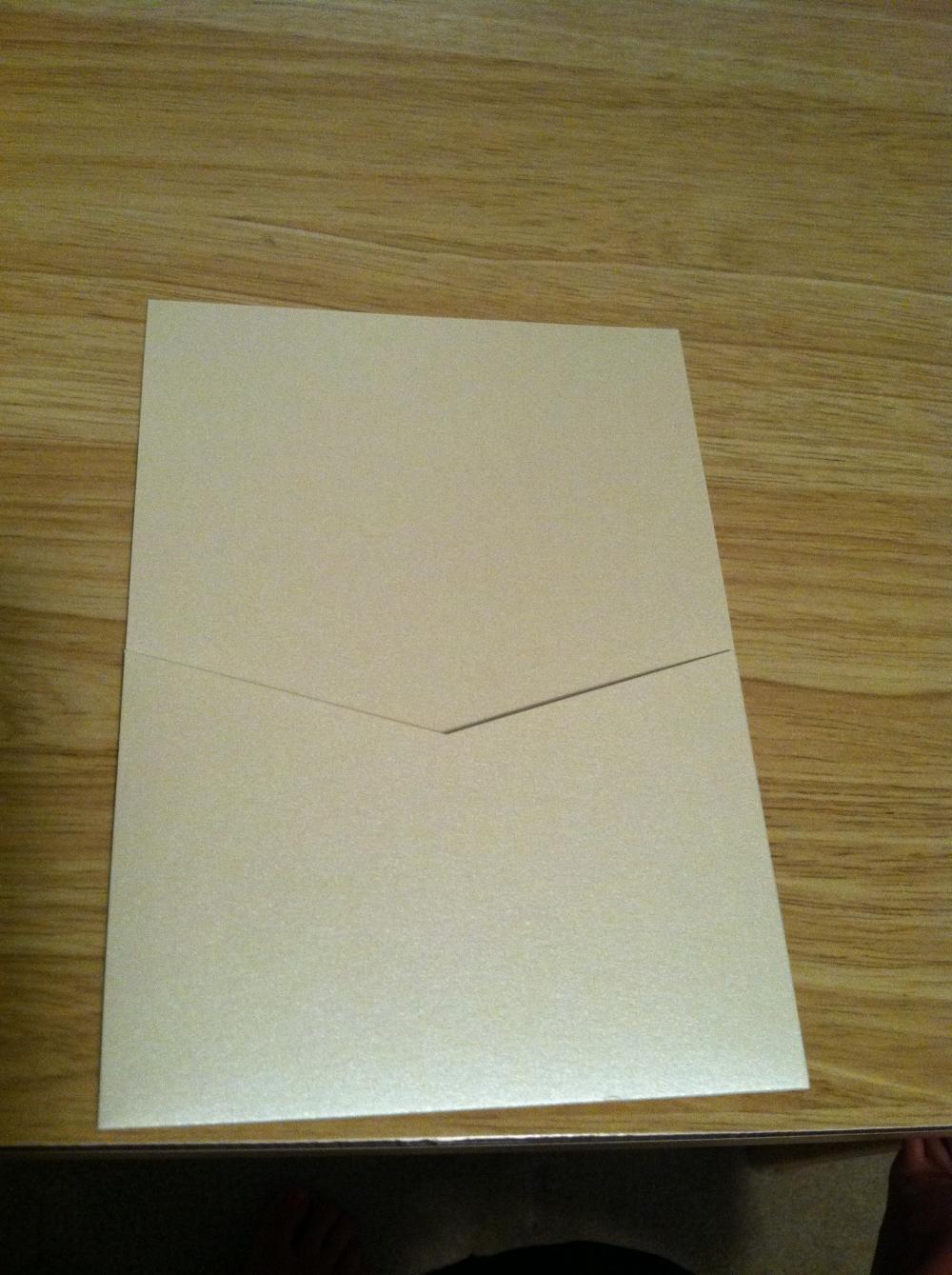 These enclosures are also from Paper-and-more.com, and I love them. They don't look it, but they are a shimmery champagne color. The response card, additional info, and at home reception cards will all go in the pocket. The invitation will go on the other