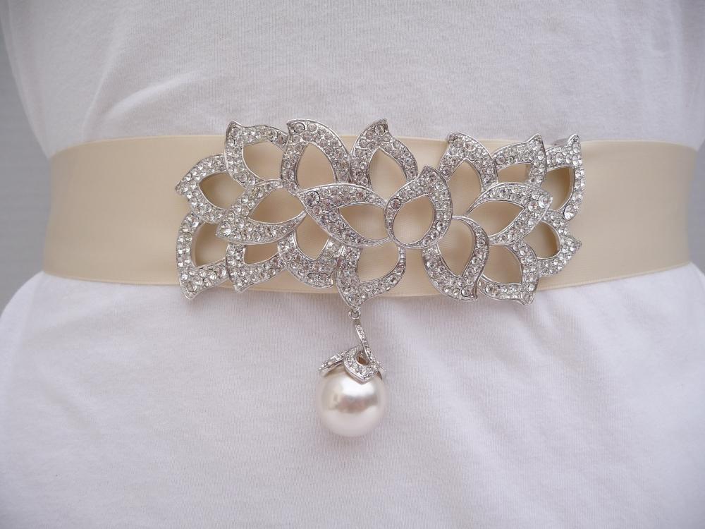 Elegant genuine rhinestone and pearl buckle style embellishment placed on an Ivory double faced satin ribbon.  Buy at www.BellaCescaBoutique.Etsy.com