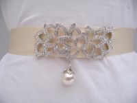 Elegant genuine rhinestone and pearl buckle style embellishment placed on an Ivory double faced satin ribbon.  Buy at www.BellaCescaBoutique.Etsy.com