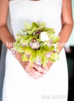 apple green cymbidium orchids and white calla lilies, semiround bouquet wrapped with white satin ribbon. 