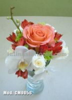 white phaleanopsis orchid with red alstroemeria and pink roses wedding centerpiece