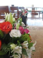 combination of fiucsa, white, orange and green flowers for aisle decor