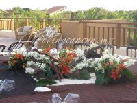 monumental  centerpiece. White orchids and orange lilies in logs