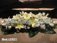 ivory roses and oriental lily with white alstroemeria centerpiece