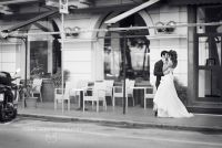 The bride and groom pose in front of the Lido Palace in Santa Margherita, Italy. 