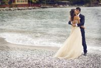 The couple pose for their dramatic beach portraits on the shores of Santa Margherita, italy. 