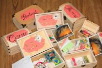 These were the boxes that I gave to my bridesmaids.  I want to have a destination wedding.  They included:
*bridesmaid's name on the outside
*"be my bridesmaid" on the inside flap in stickers
*home-made postcard of tropical photo I took in Cuba (says "