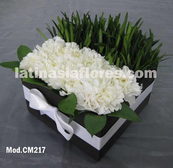 white carnations with foliage wedding centerpiece