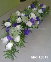 ivory roses and purple lisianthus wedding centerpiece