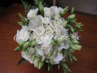 Mexican calla lilies (alcatraces), baby roses and lisianthus wedding bouquet.
