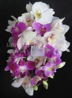 dendrobium, phaleanopsis and cymbidium orchids wedding bouquet in purple and white