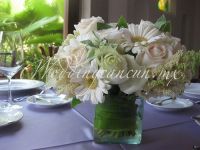 white gerberas, white lisianthus and ivory roses with a touch of green centerpiece