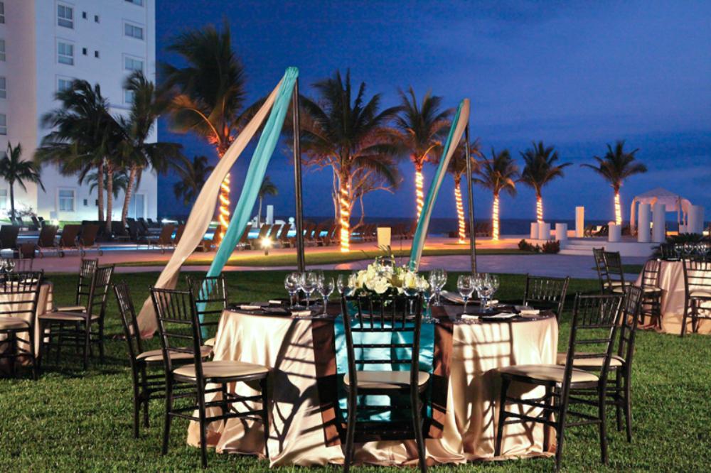 www.crystalwaterweddings.com Experienced travel agents who strongly value providing first class service and have a deep passion for destination weddings.  Dreams Villamagna Nuevo Vallarta.  A elegant nighttime reception set-up with fabulous views of the B