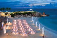 www.crystalwaterweddings.com Experienced travel agents who strongly value providing first class service and have a deep passion for destination weddings.  Dreams Cancun Resort & Spa.  Group dinner set up on the sandy-white beach with the magnificent weddi