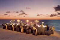  www.crystalwaterweddings.com Experienced travel agents who strongly value providing first class service and have a deep passion for destination weddings.   Dreams Riviera Cancun Resort & Spa.  A dinner set-up on the beach during sunset offers stunning vi
