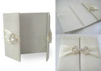 Uniquely handmade silk folio for wedding invitation shown in ivory color with silver plated crystal clasp as featured by NANGFA widely.