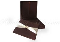 Chocolate silk invitation box, shown in a standard size of 7x7x1 with removable pad and gold plated crystal embellishment featuring 2 inches wide ribbon and extra padding.