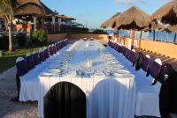 Reception table on the beach terrace, so we had 26 sashes for the ceremony, and 31 for the reception, we paid for 31, I wasn't gonna have 5 chairs without shashes for 25$ difference...