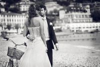 The bride and groom pose on the main beach in Santa Margherita, Italy. 