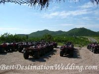ATV's lined up with mountains in the background