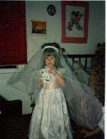 This picure was taken when I was 4 years old. I was the flower girl in a wedding and was infatuated with weddings ever since. 