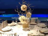 rose pomanders in tall dry branches centerpiece