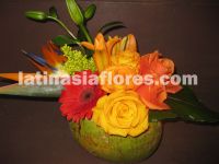 Tropical centerpiece. Combination of orange,  yellow and red flowers