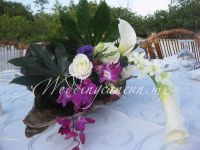 Calla lilies, dendrobium orchids and roses centerpiece.
