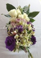 white alstroemeria with purple  roses, lisianthus and white roses centerpiece