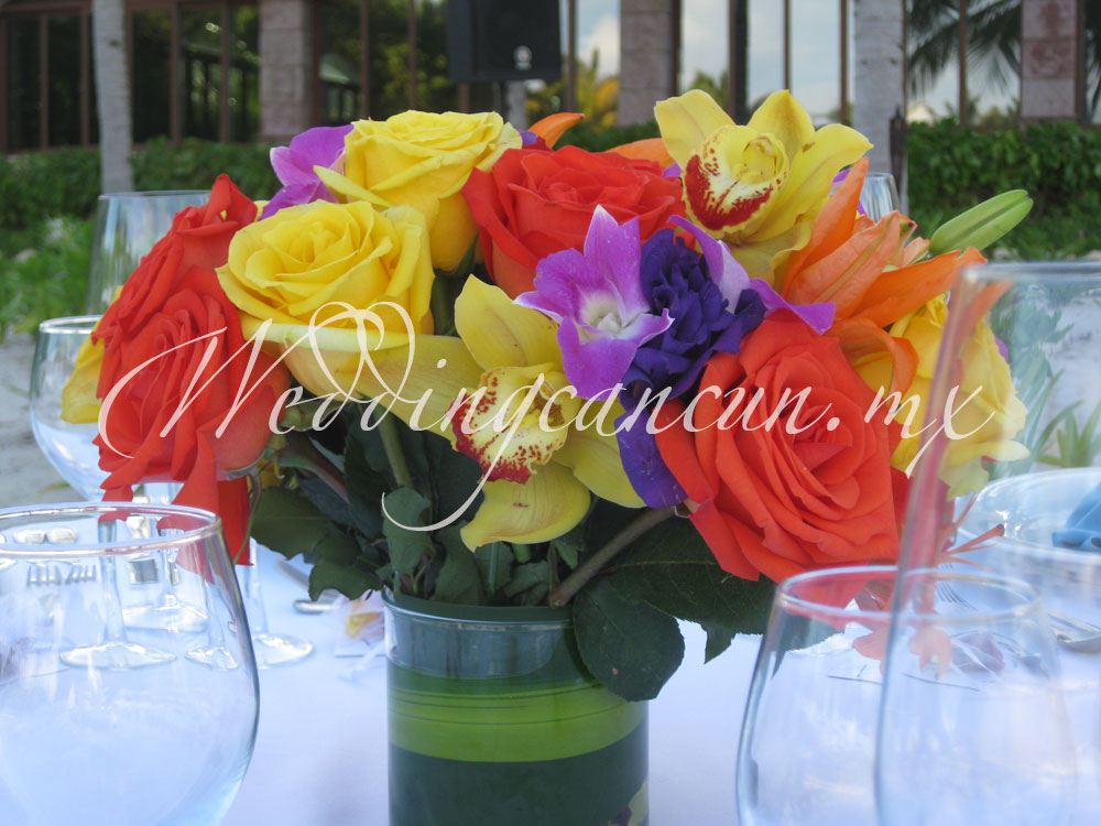 roses, lilies, cymbidium orchids, lisianthus and dendrobium orchids colorful centerpiece