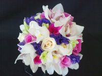 white cymbidium orchids and purple lisianthus with fyusha roses and ivory roses bouquet
