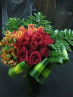 red roses and orange roses with orange alstroemeria wedding centerpiece