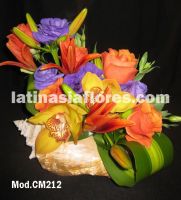orange roses and lilies with purple lisianthus and yellow cymbidium orchids wedding centerpiece